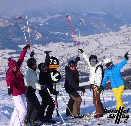 Happy Skiiers on top of the world